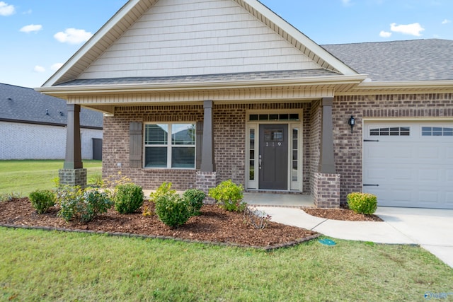 view of front of house featuring a front lawn and a garage