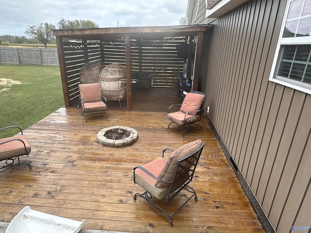 wooden terrace with a fire pit