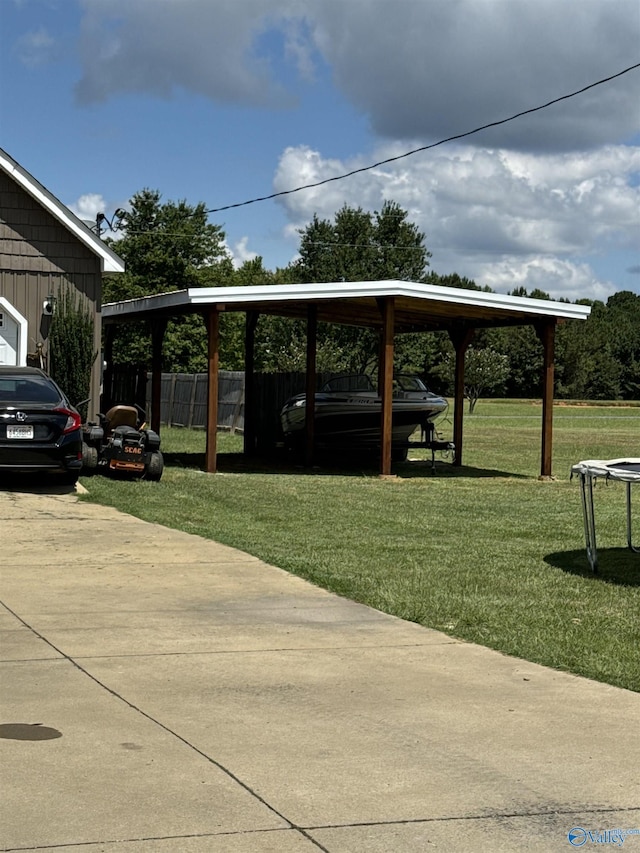 view of parking featuring a carport and a lawn