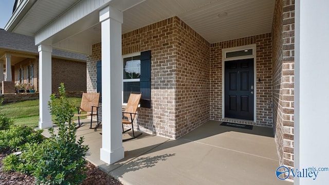 doorway to property featuring covered porch