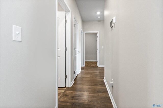 hallway featuring dark wood-type flooring