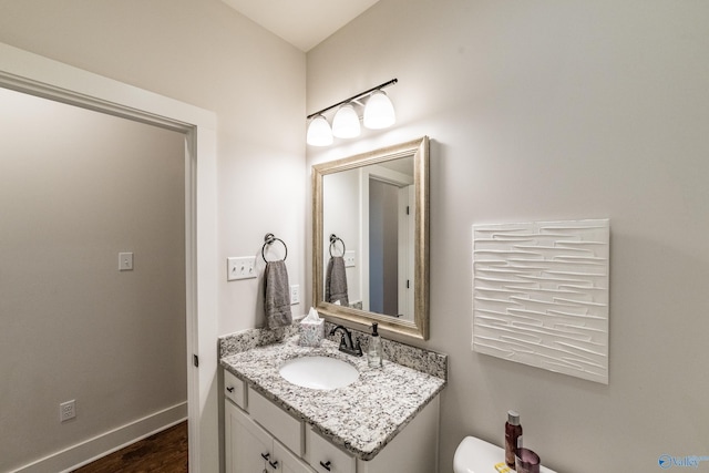 bathroom featuring hardwood / wood-style floors and vanity