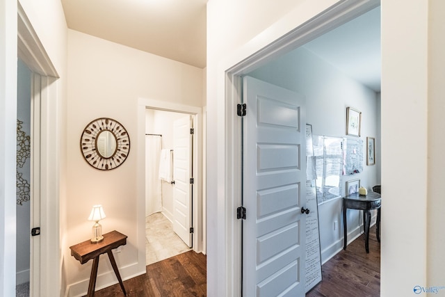 hall with dark hardwood / wood-style flooring