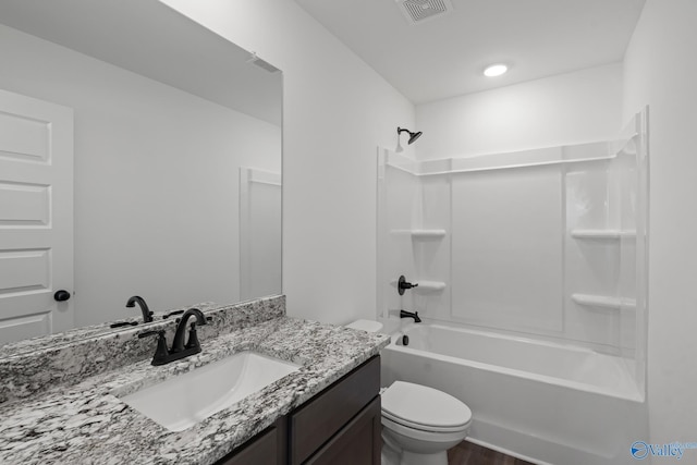 full bathroom with vanity, wood-type flooring,  shower combination, and toilet