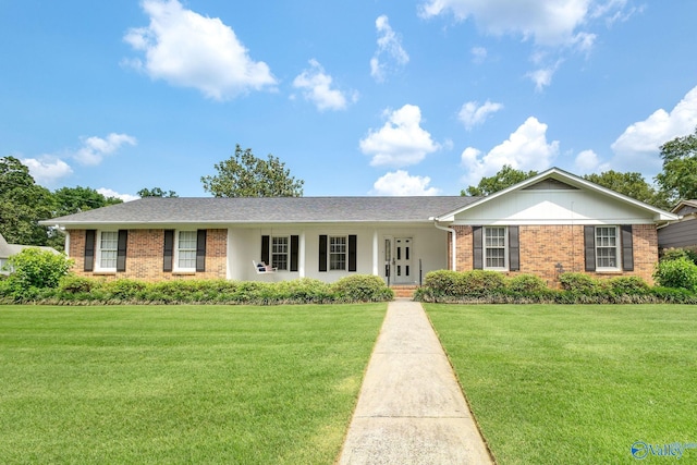 708 Apache St NW, Hartselle, AL 35640 - ranch-style home featuring brick siding and a front yard