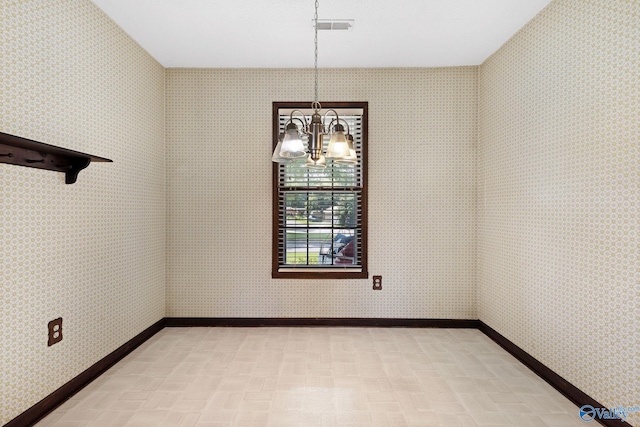 708 Apache St NW, Hartselle, AL 35640 - spare room featuring a chandelier and light floors