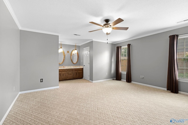 708 Apache St NW, Hartselle, AL 35640 - unfurnished bedroom featuring light carpet, crown molding, baseboards, ensuite bath, and ceiling fan