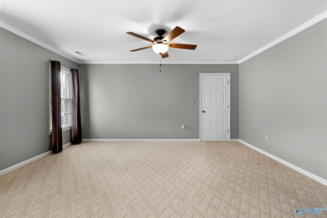708 Apache St NW, Hartselle, AL 35640 - spare room featuring a ceiling fan, ornamental molding, light colored carpet, baseboards, and a textured ceiling