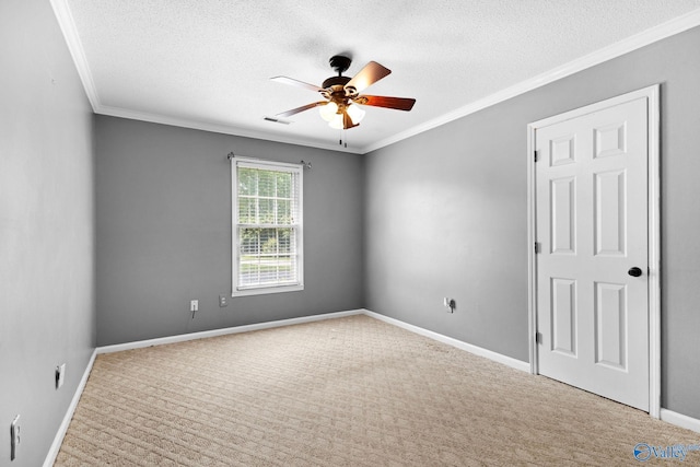 708 Apache St NW, Hartselle, AL 35640 - carpeted spare room with ceiling fan, crown molding, a textured ceiling, and baseboards