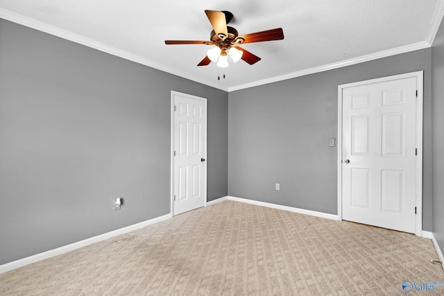 708 Apache St NW, Hartselle, AL 35640 - spare room featuring a ceiling fan, carpet, crown molding, and baseboards