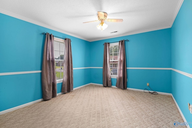 708 Apache St NW, Hartselle, AL 35640 - carpeted empty room with a ceiling fan, a textured ceiling, baseboards, and ornamental molding