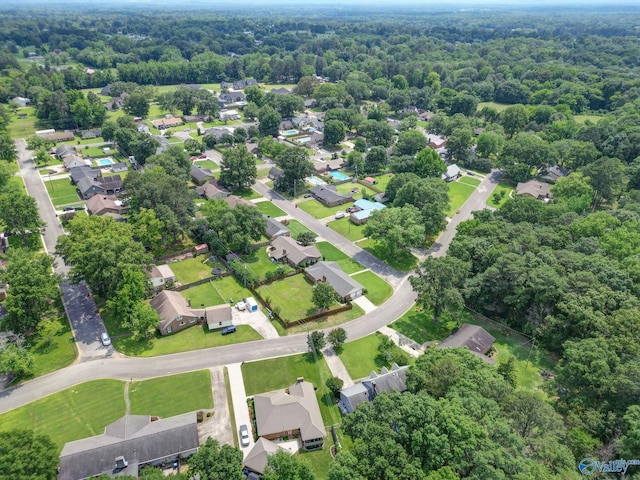 708 Apache St NW, Hartselle, AL 35640 - aerial perspective of suburban area with a heavily wooded area