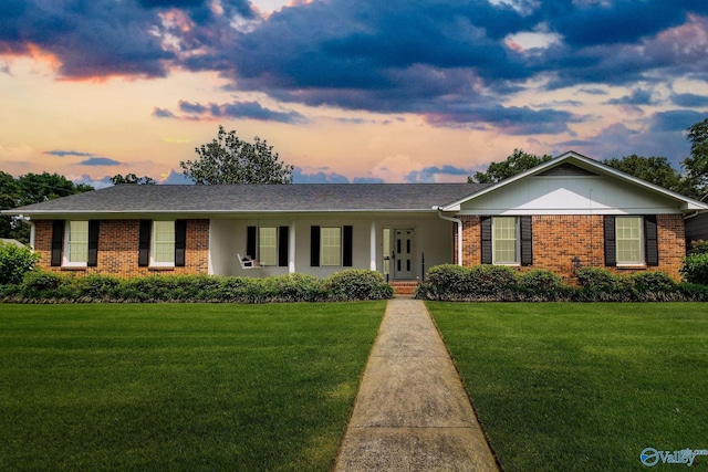 708 Apache St NW, Hartselle, AL 35640 - ranch-style house featuring brick siding and a front lawn