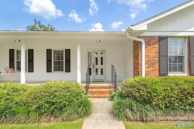 708 Apache St NW, Hartselle, AL 35640 - entrance to property featuring brick siding and a porch