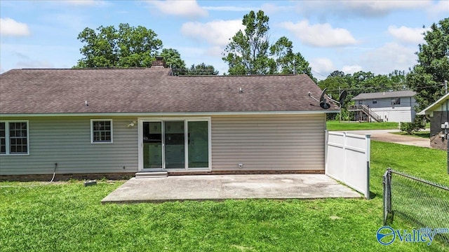 304 Ohara Dr, Albertville, AL 35950 - back of property with a patio area, a chimney, and roof with shingles