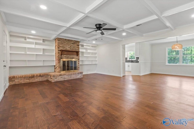 304 Ohara Dr, Albertville, AL 35950 - unfurnished living room with wood-type flooring, baseboards, ceiling fan, coffered ceiling, and a fireplace