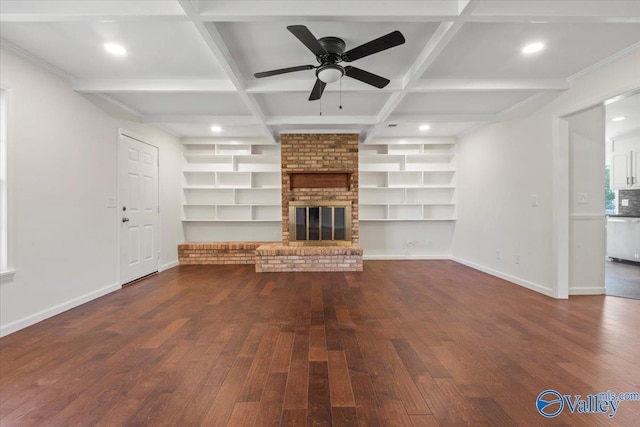 304 Ohara Dr, Albertville, AL 35950 - unfurnished living room featuring hardwood / wood-style floors, ceiling fan, baseboards, a brick fireplace, and built in shelves