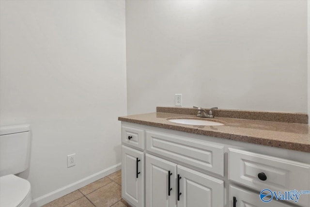 304 Ohara Dr, Albertville, AL 35950 - bathroom with toilet, vanity, tile patterned flooring, and baseboards