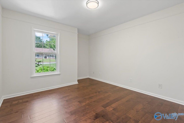 304 Ohara Dr, Albertville, AL 35950 - spare room with dark wood-style floors and baseboards