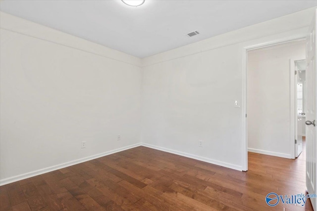 304 Ohara Dr, Albertville, AL 35950 - empty room with wood finished floors and baseboards