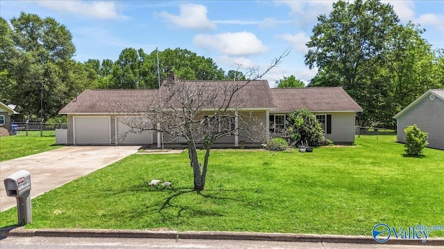 304 Ohara Dr, Albertville, AL 35950 - view of front facade with concrete driveway, a chimney, an attached garage, and covered porch