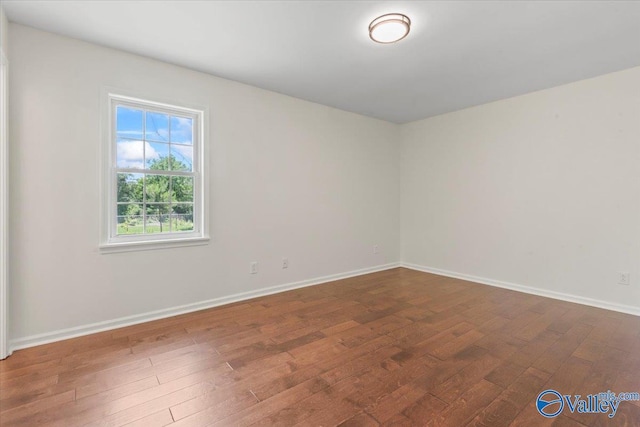 304 Ohara Dr, Albertville, AL 35950 - spare room with wood-type flooring and baseboards