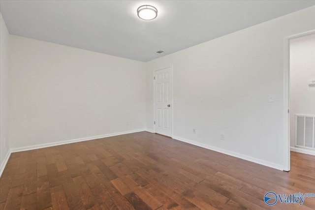 304 Ohara Dr, Albertville, AL 35950 - unfurnished room with dark wood-style floors and baseboards