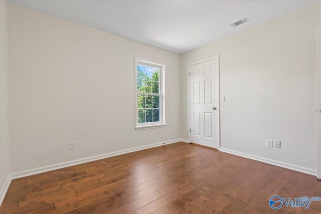 304 Ohara Dr, Albertville, AL 35950 - spare room with dark wood finished floors and baseboards
