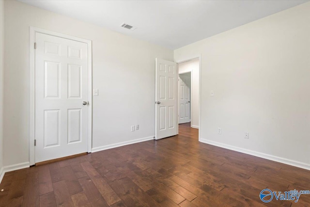 304 Ohara Dr, Albertville, AL 35950 - unfurnished bedroom featuring hardwood / wood-style floors and baseboards