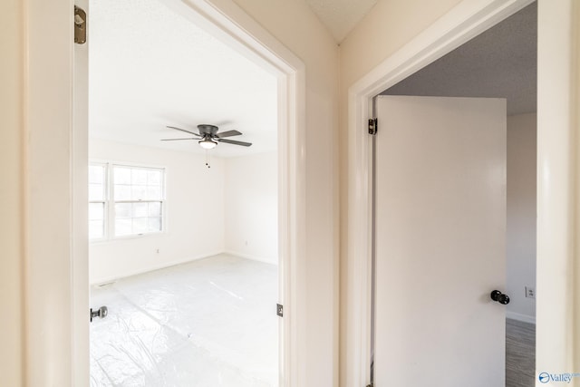 corridor with a textured ceiling