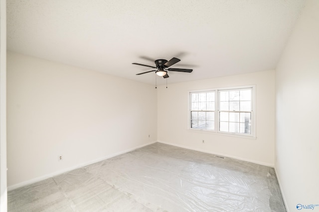 spare room with ceiling fan