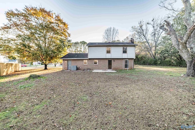 rear view of house featuring a patio area and central air condition unit