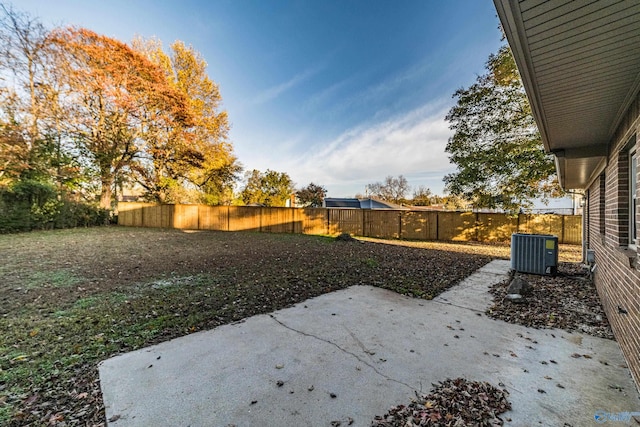 view of yard featuring cooling unit and a patio area