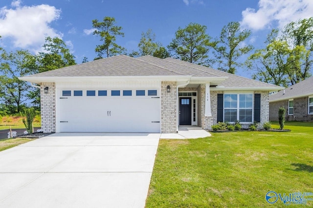 view of front facade with a front yard and a garage