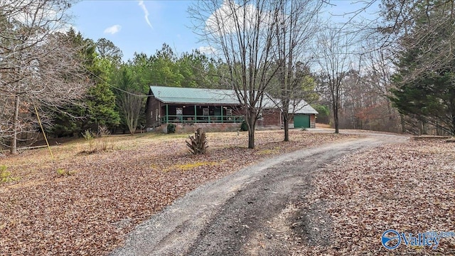 view of front of property with a garage and covered porch