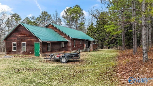 view of property exterior featuring a lawn