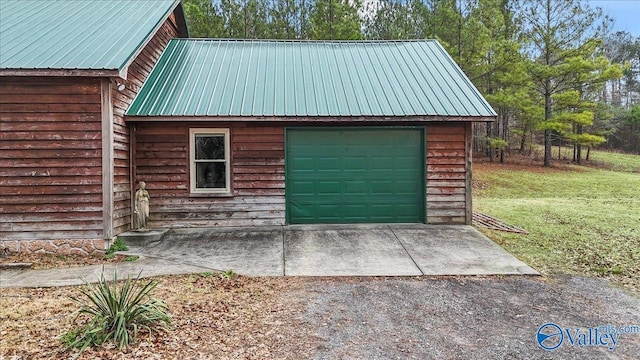 garage featuring a yard