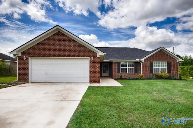 27586 Phillip Wagnon Dr, Athens, AL 35613 - ranch-style home with brick siding, a front lawn, concrete driveway, and an attached garage