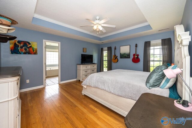 27586 Phillip Wagnon Dr, Athens, AL 35613 - bedroom with a raised ceiling, hardwood / wood-style flooring, baseboards, crown molding, and ensuite bathroom