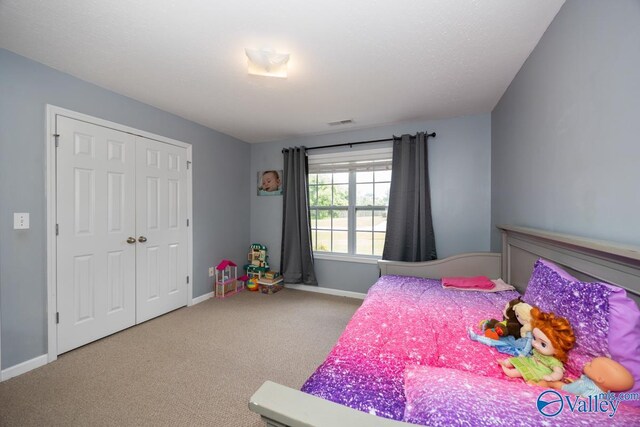 27586 Phillip Wagnon Dr, Athens, AL 35613 - carpeted bedroom featuring baseboards and a closet