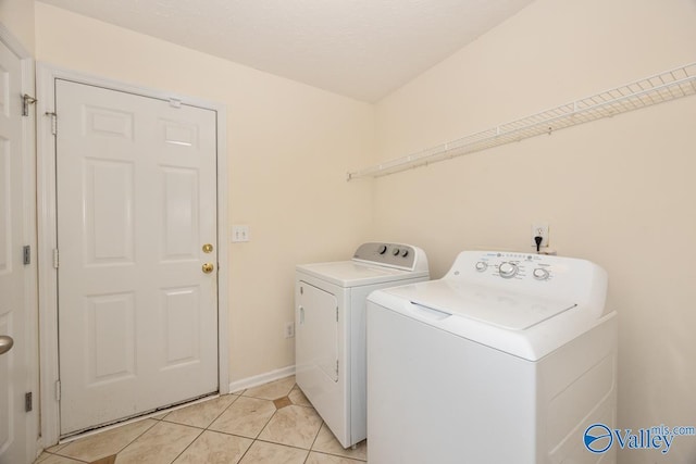 27586 Phillip Wagnon Dr, Athens, AL 35613 - washroom with separate washer and dryer, light tile patterned floors, and baseboards