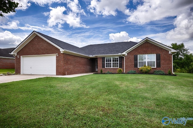 27586 Phillip Wagnon Dr, Athens, AL 35613 - ranch-style house with brick siding, an attached garage, a front yard, and concrete driveway