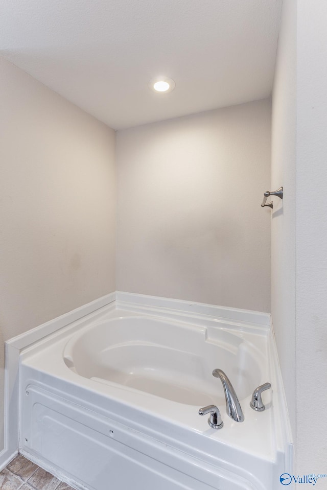 bathroom featuring a tub to relax in