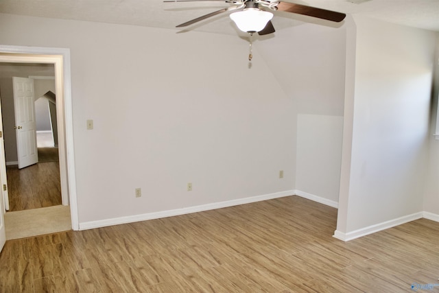 spare room with ceiling fan and light wood-type flooring