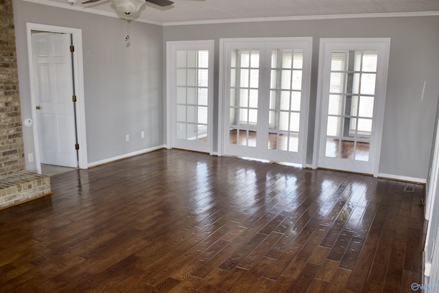 empty room featuring ceiling fan, dark hardwood / wood-style flooring, and crown molding