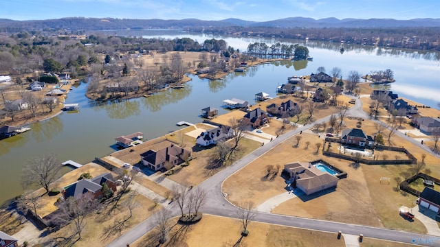 bird's eye view with a water and mountain view