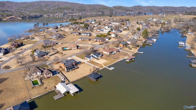 drone / aerial view with a water and mountain view