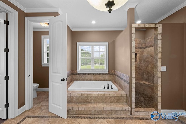 bathroom with tile patterned flooring, ornamental molding, separate shower and tub, and toilet