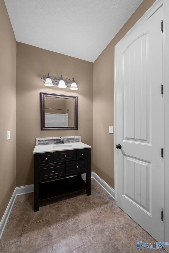 bathroom featuring vanity and tile patterned flooring