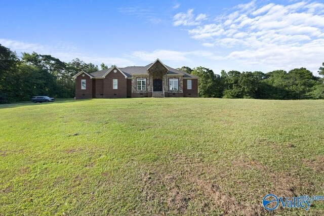 ranch-style home with a front lawn